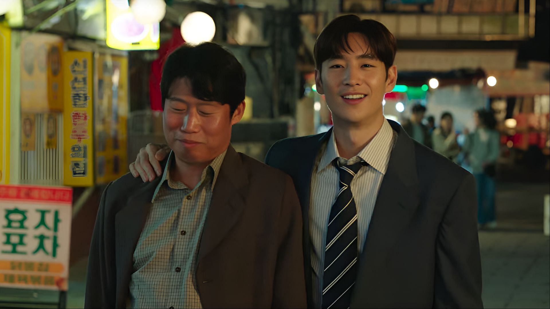 Choi In-beom (Lee Je-hoon) and Pyo Jong-rok (Yoo Hae-jin) share a rare moment of camaraderie outside the office in Big Deal. (Image via Well Go USA Entertainment)